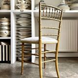 Napoleon III chair in gilded bamboo wood and beige cotton.