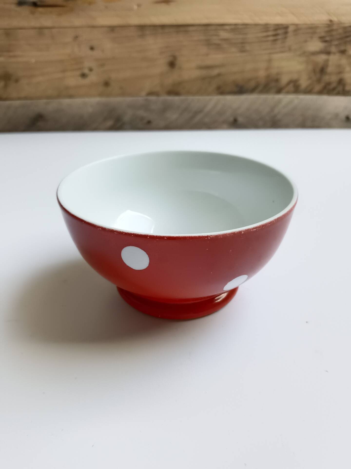 Red bowl with white polka dots in Longchamp ceramic