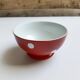 Red bowl with white polka dots in Longchamp ceramic