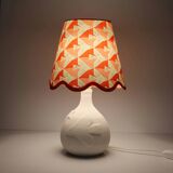 Small lamp with matte finish ceramic base and printed scalloped lampshade