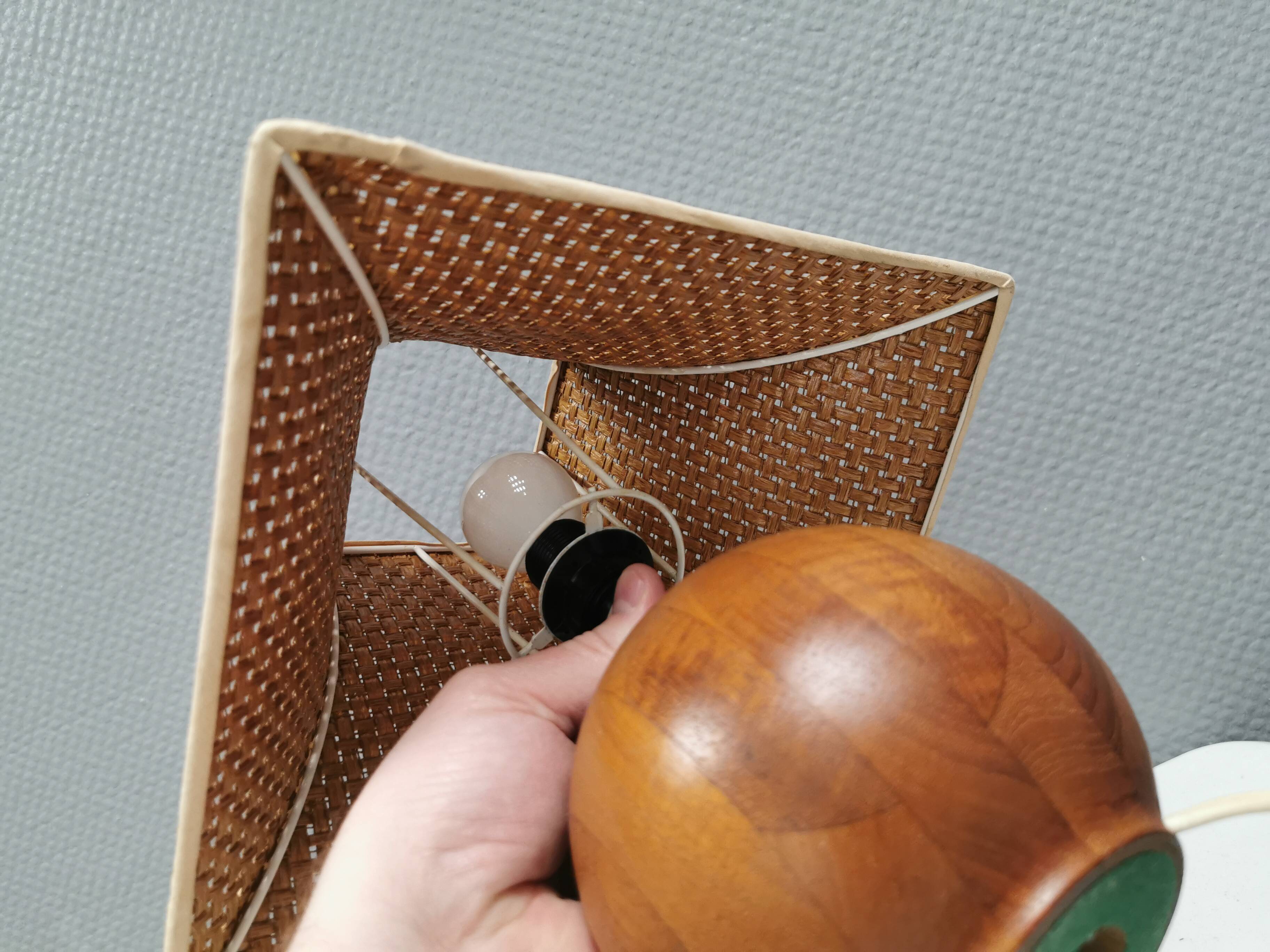 Very rare table lamp in turned teak wood with original braided shade. 1970s