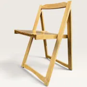 Blonde wooden folding chair in the style of Aldo Jacober.