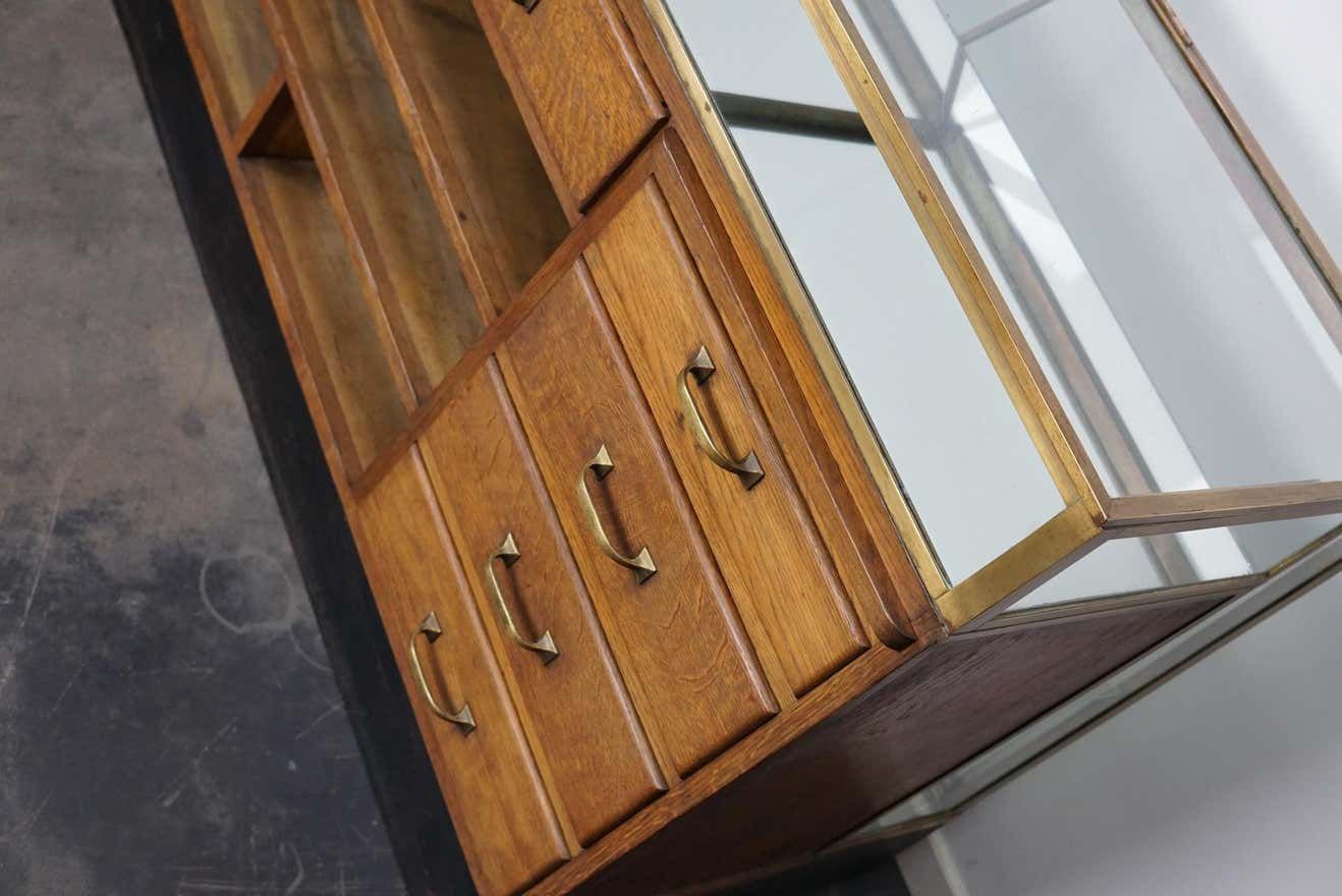 Counter or shop window in oak glass and brass France around 1920