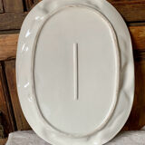 Very large serving dish with hares and vegetables.