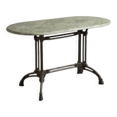 Table ovale en marbre vert à orthocères & pied en fonte / fer forgé