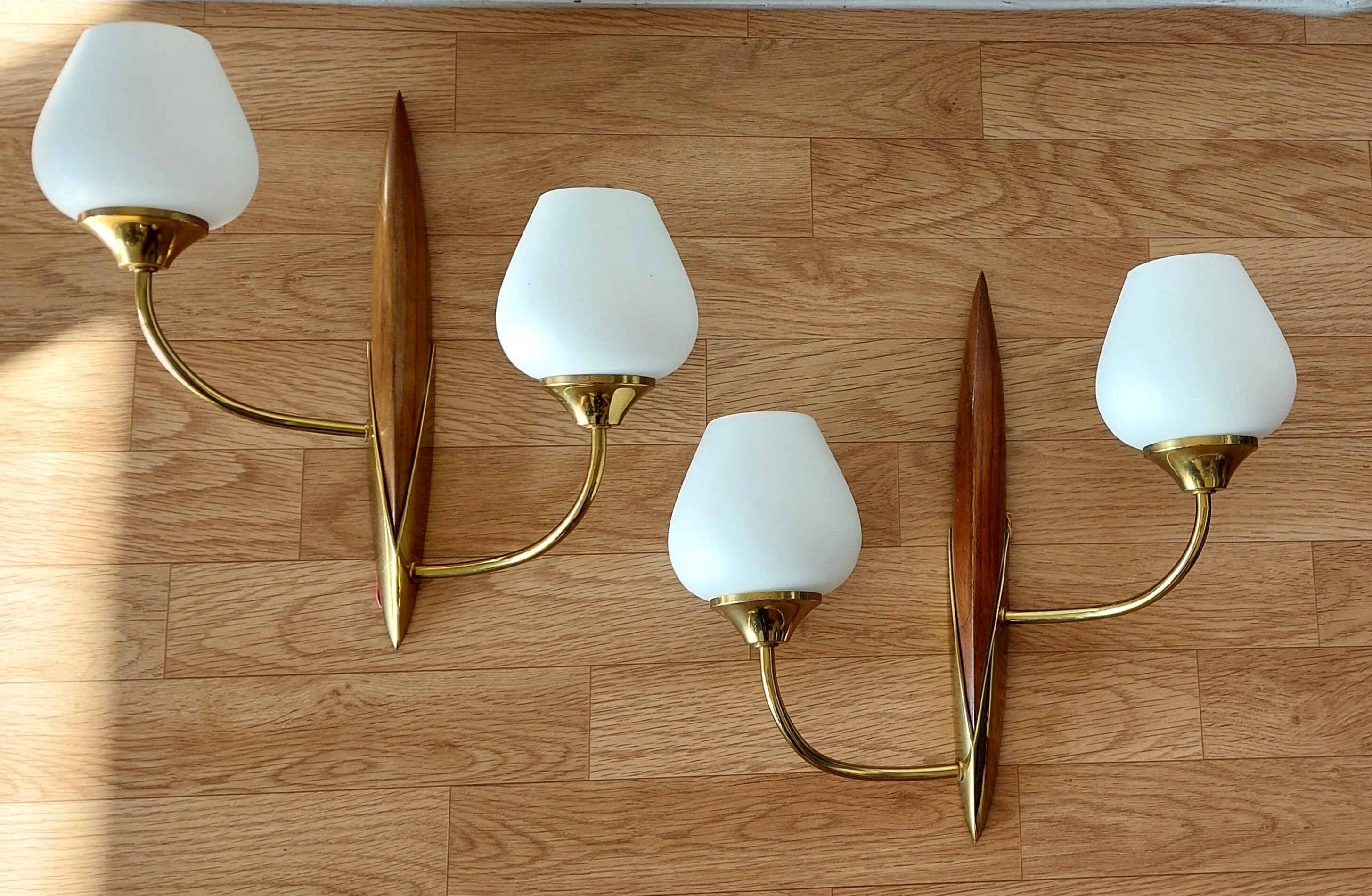 Pair of wood and gilded brass sconces 1950 boat hulls with 2 lights.