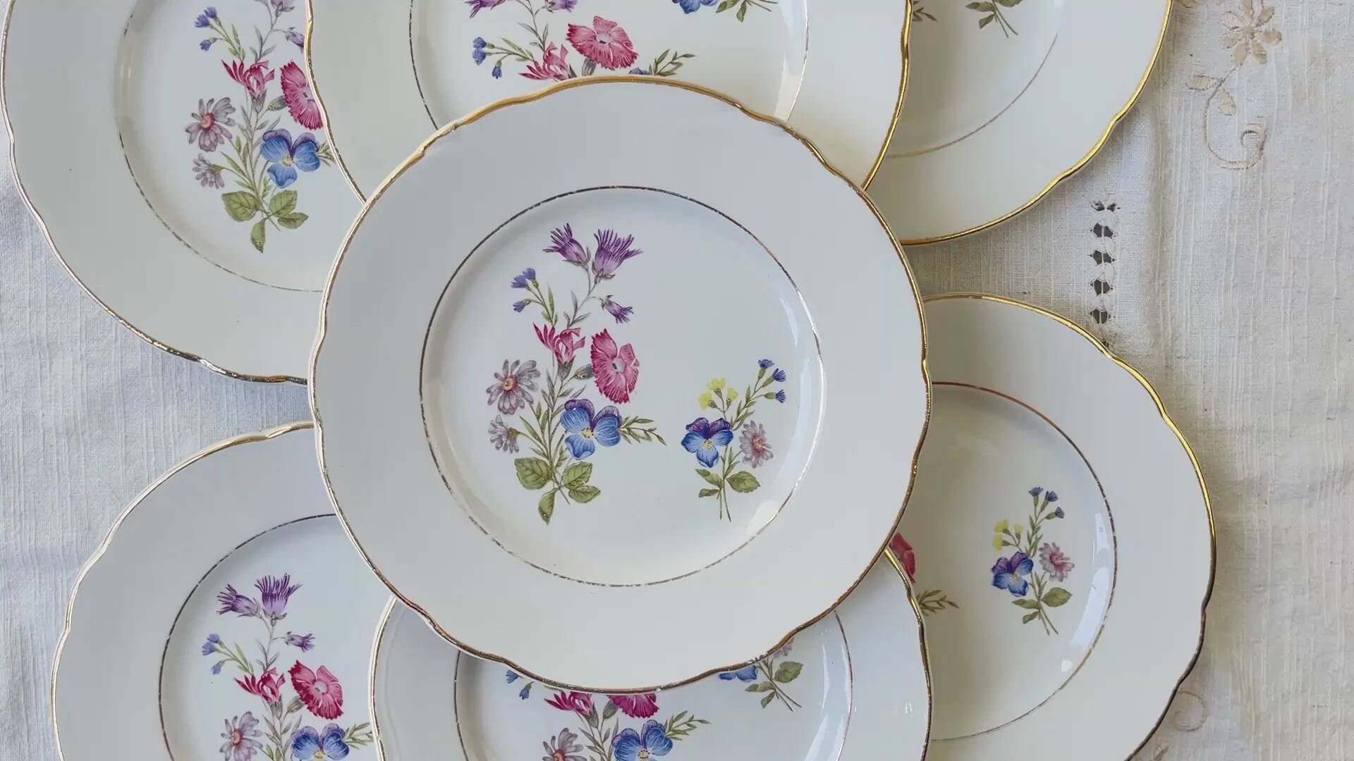 7 small vintage porcelain plates with floral pattern KG Luneville