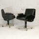 Pair of swivel armchairs, imitation leather and steel, Italy, circa 1960.