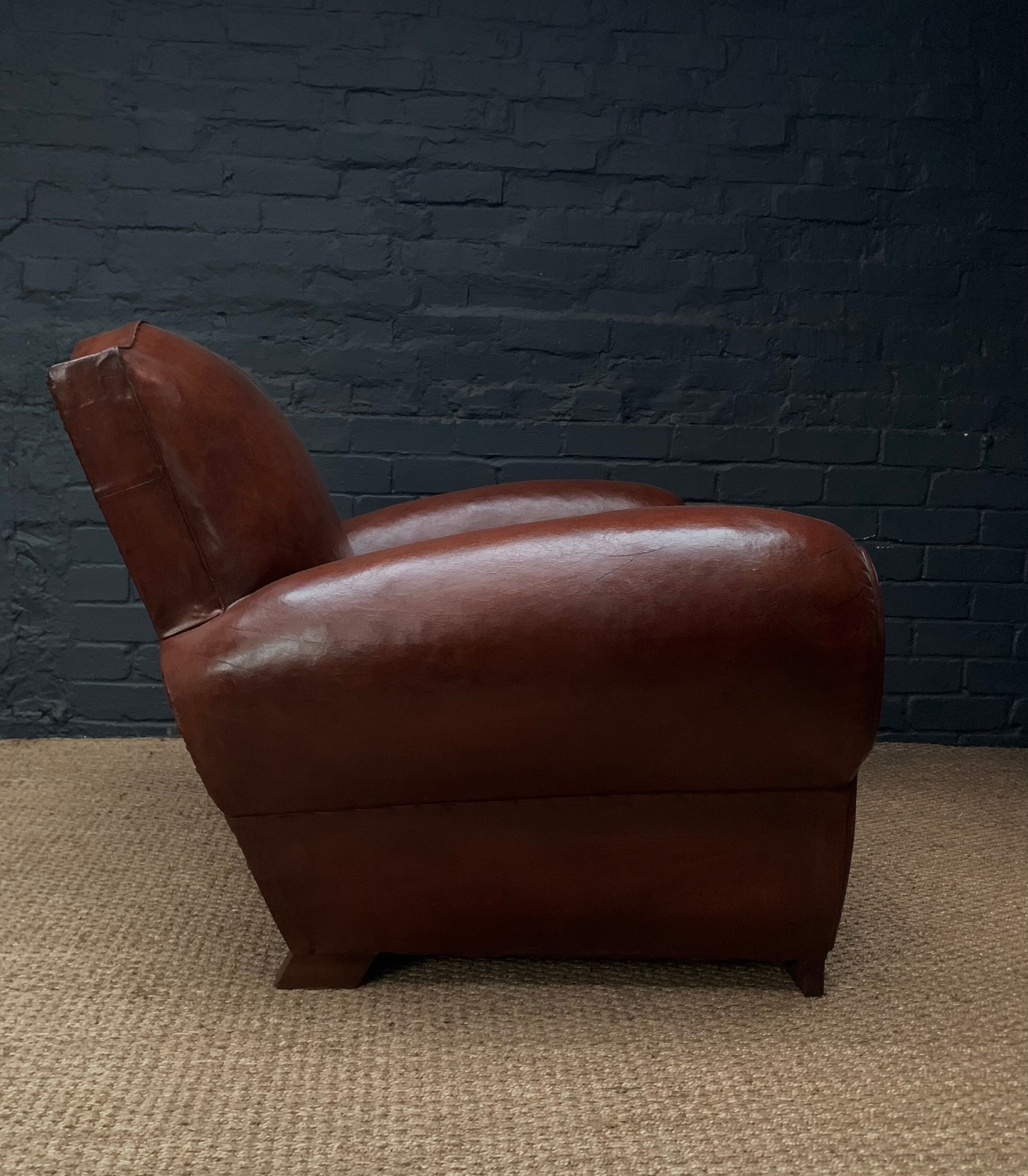 Leather club chair, havana moustache model, with cuban cigar arms, circa 1930's