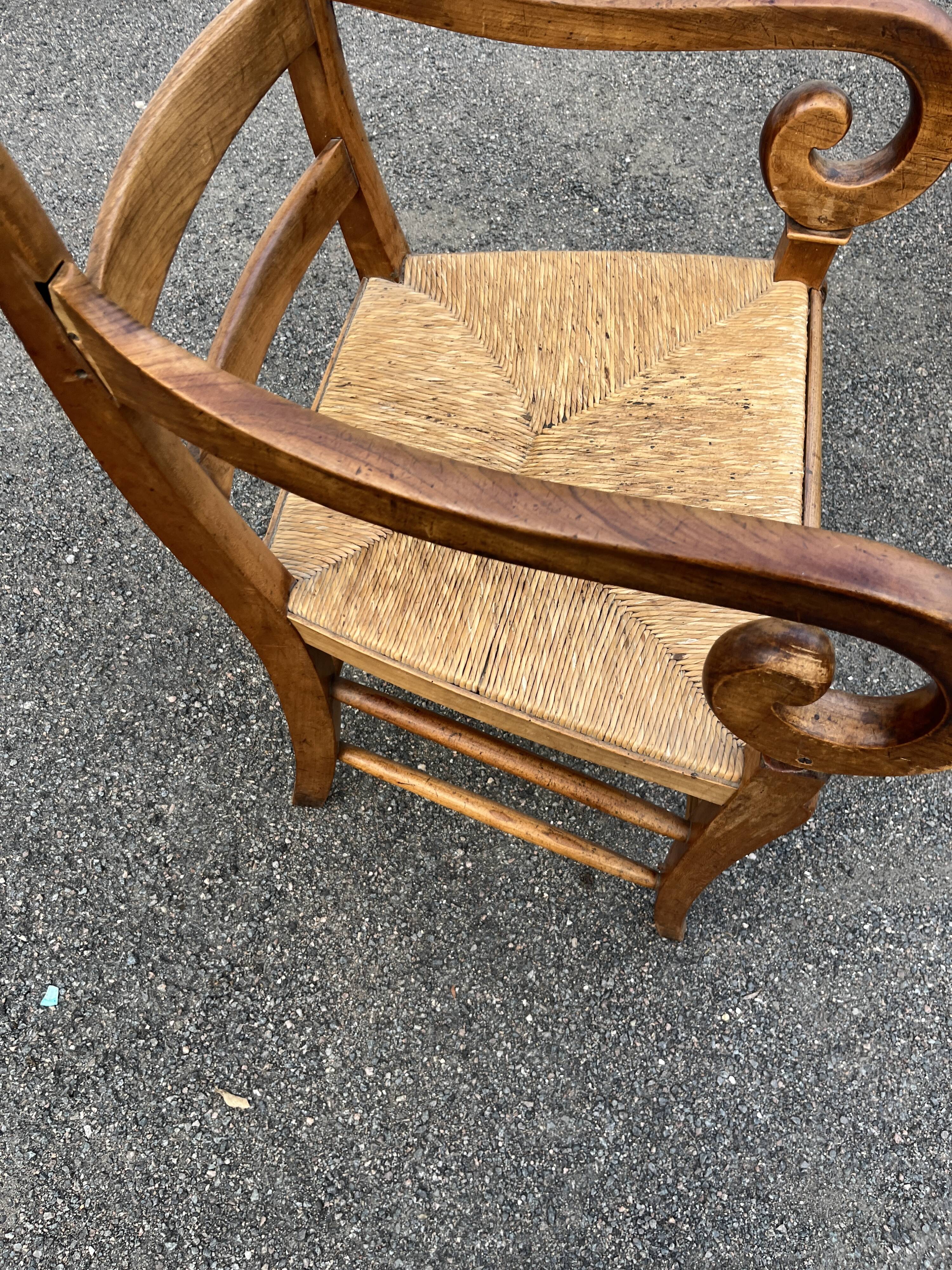 Louis Philippe country armchair in solid wood and straw, hooked armrests