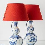 Pair of Royal Delft blue and white ceramic table lamps with new vermilion silk shades.