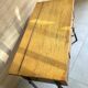 Vintage 1950s sewing machine with blonde oak veneer.