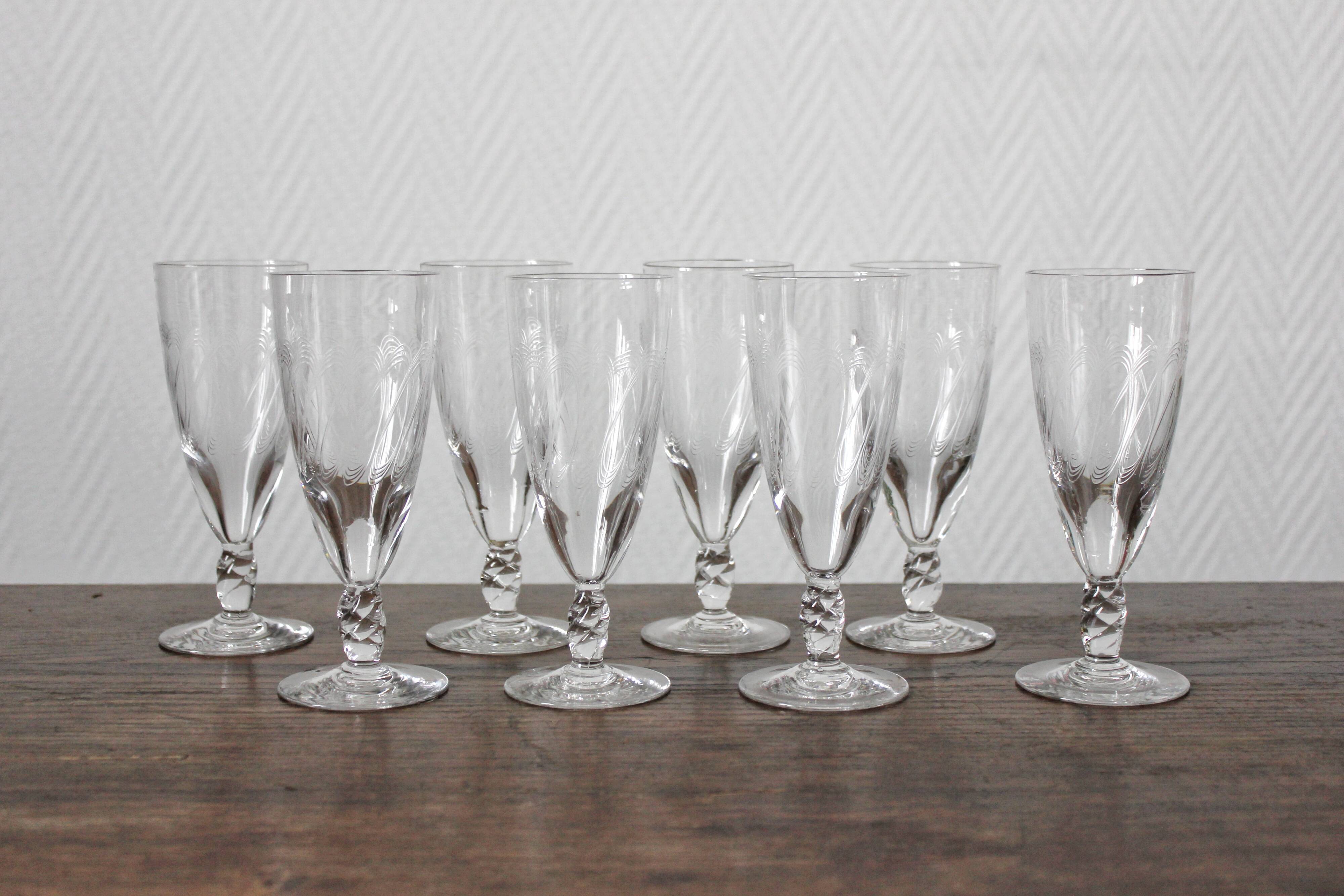 8 antique champagne flutes in engraved crystal and twisted foot