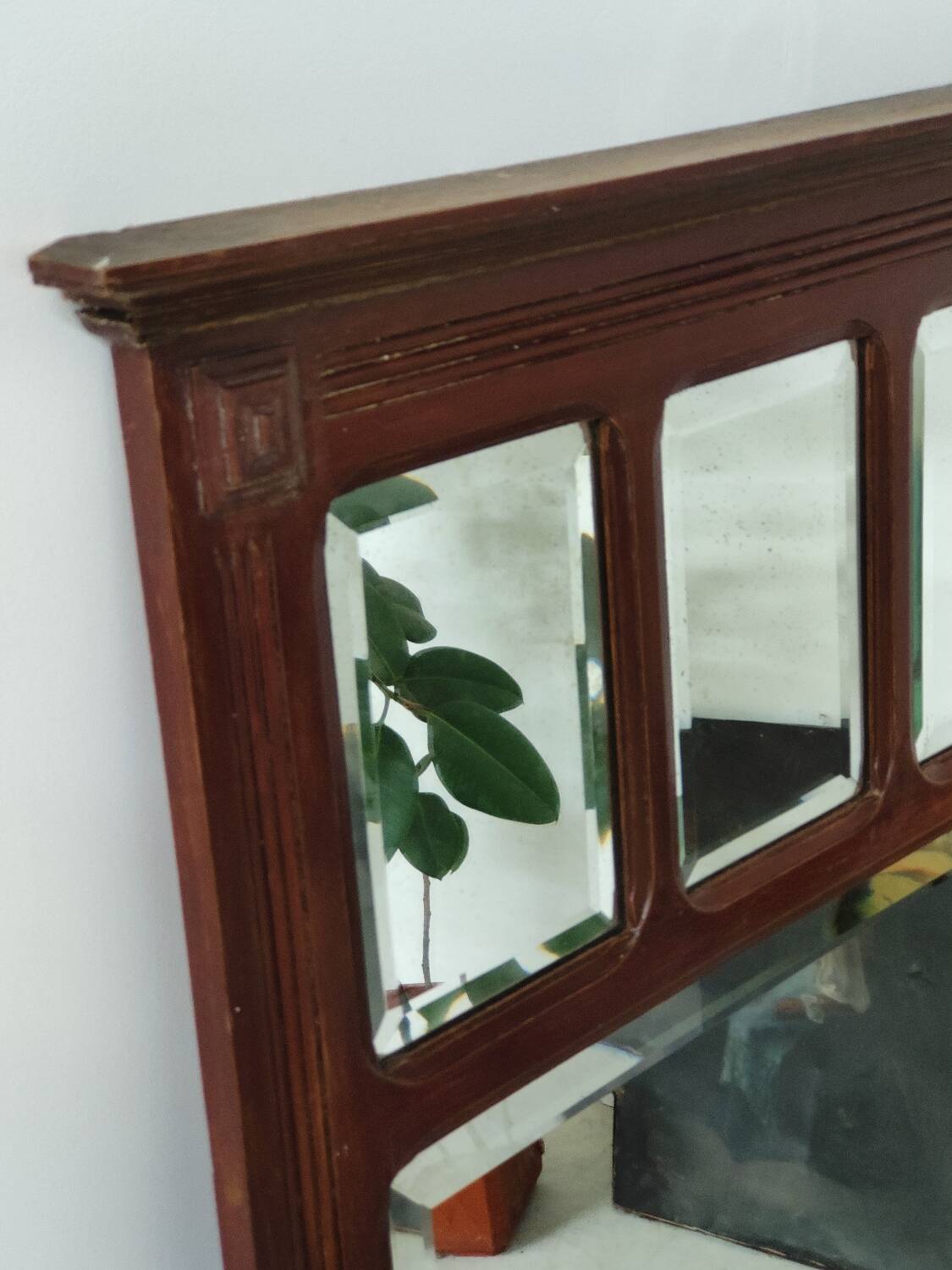 Antique beveled mirror on a wooden frame, 1930