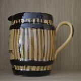 Striped pitcher and inscription