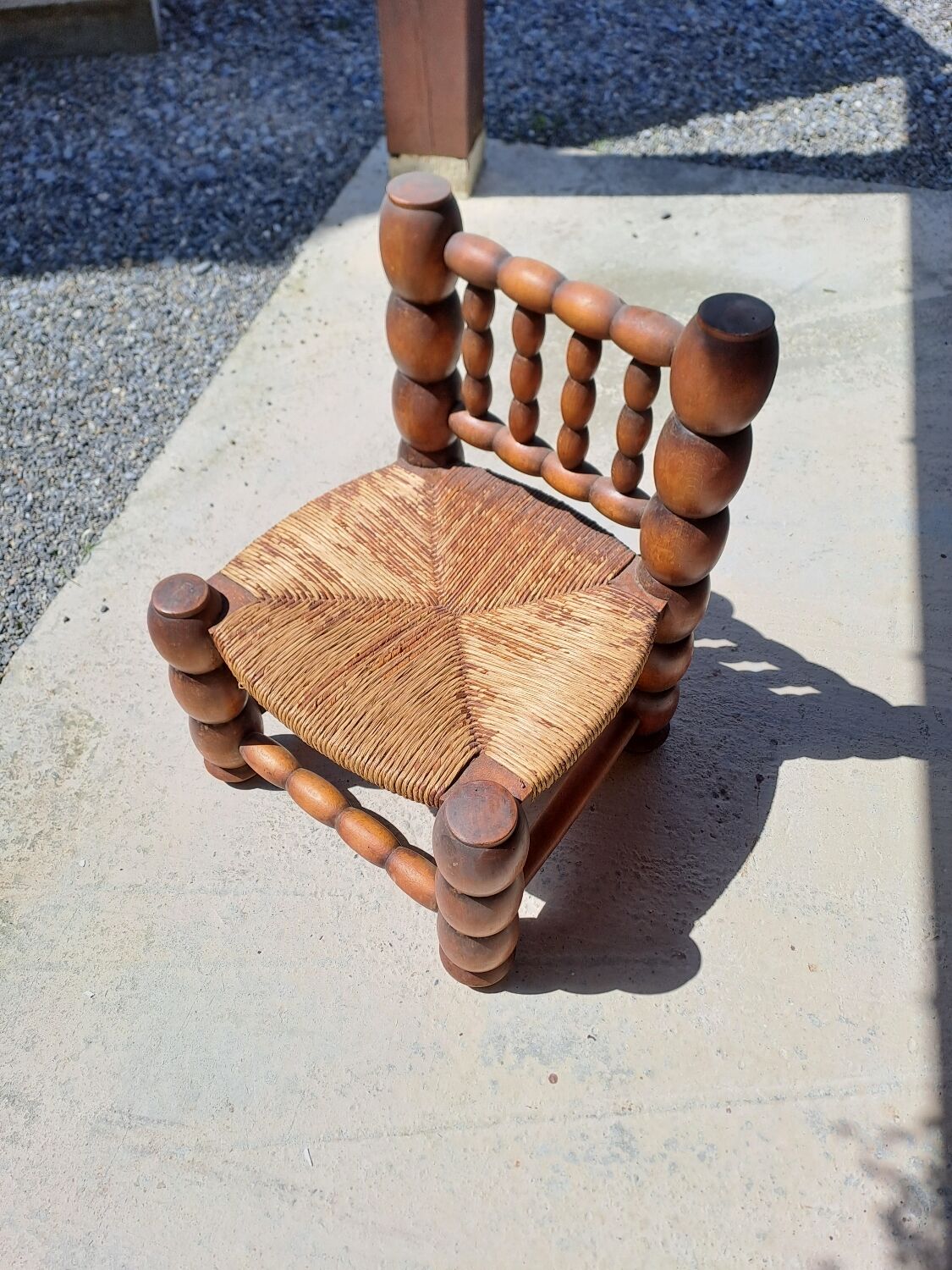 Low chair 50s oak and straw by the fire