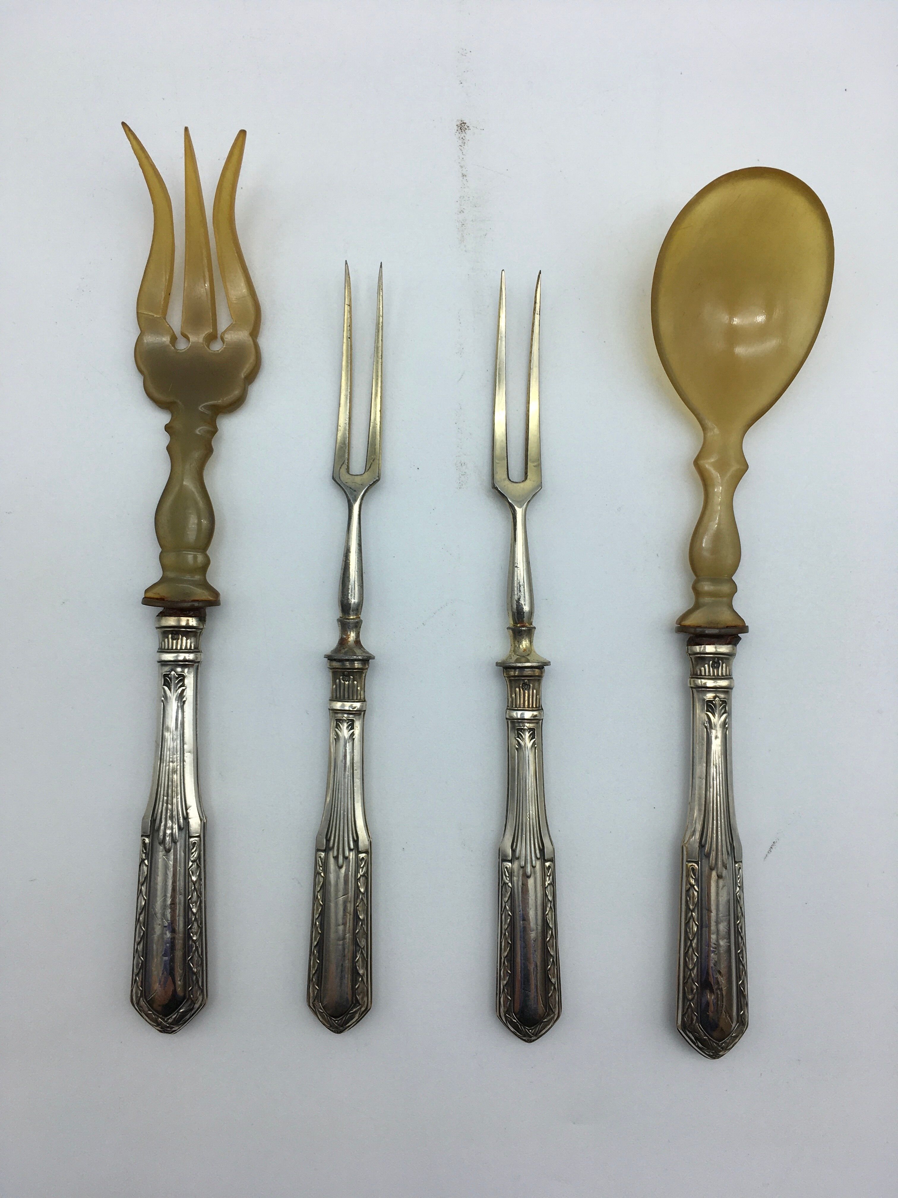 Box of filled silver salad cutlery