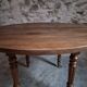 French antique round dining table in walnut, circa 1880–1900.