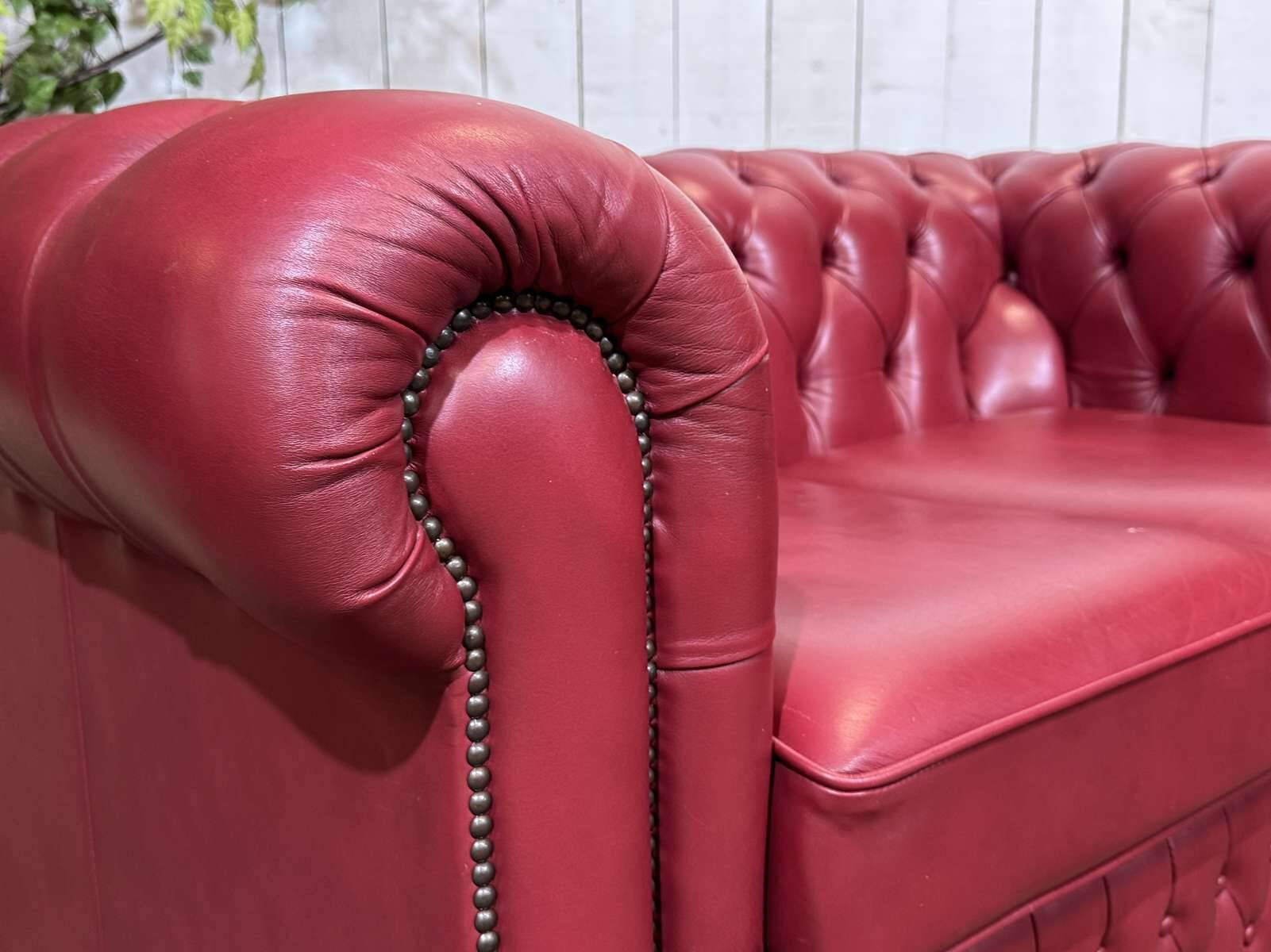 Chesterfield 2-seater leather sofa, modern production from the 2000s.
