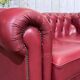 Chesterfield 2-seater leather sofa, modern production from the 2000s.