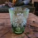 Green gradient blown glass vase with engraved floral decoration.