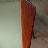 Vintage armchair in mint green wool, mid-century modern design.