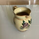Old ceramic jug with floral decoration