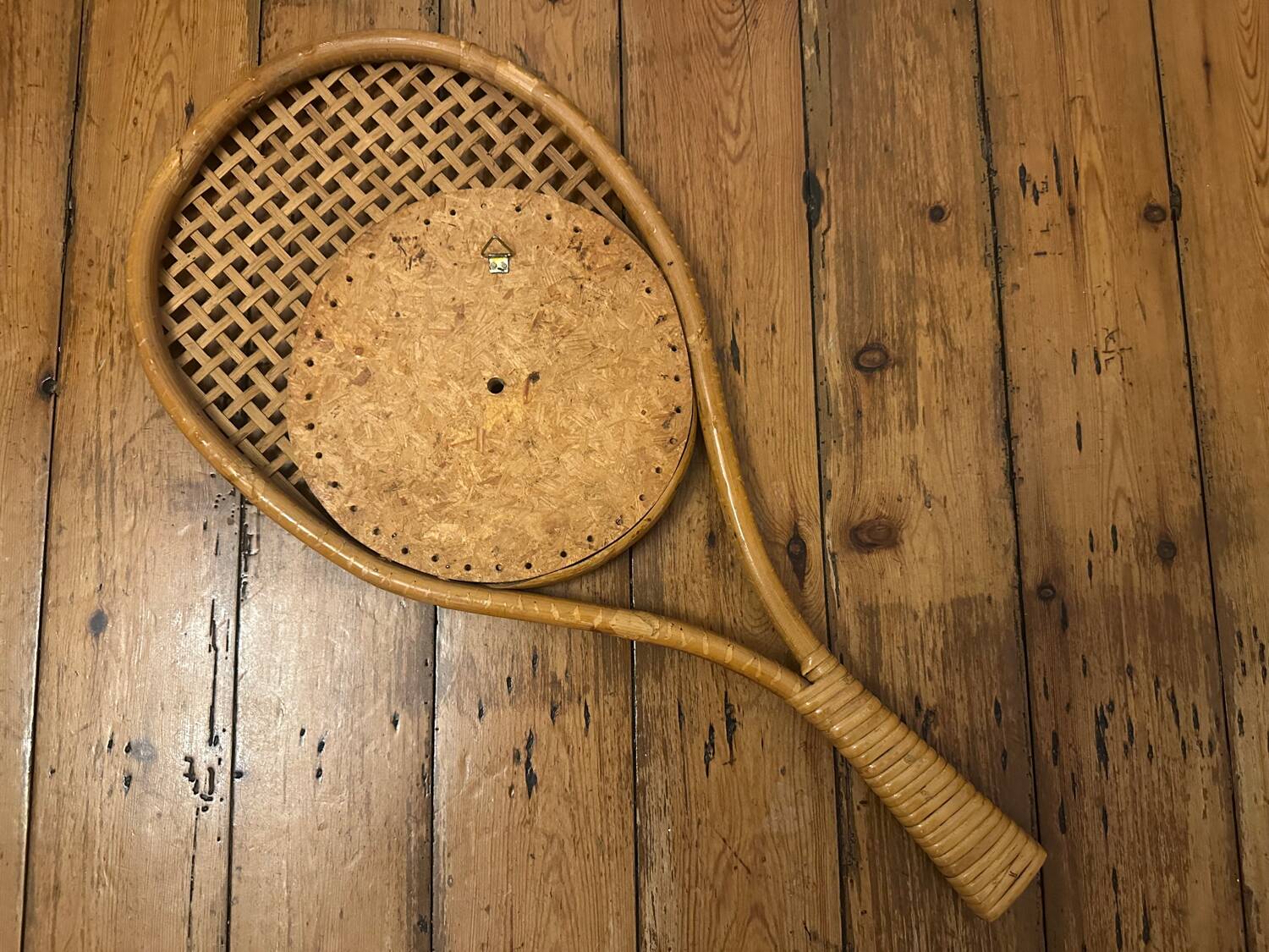 Vintage rattan tennis racket mirror