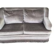Vintage taupe two-seater armchair/sofa with fringes.