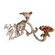 Wall lamp in antique cast iron with bird and scroll decorations.