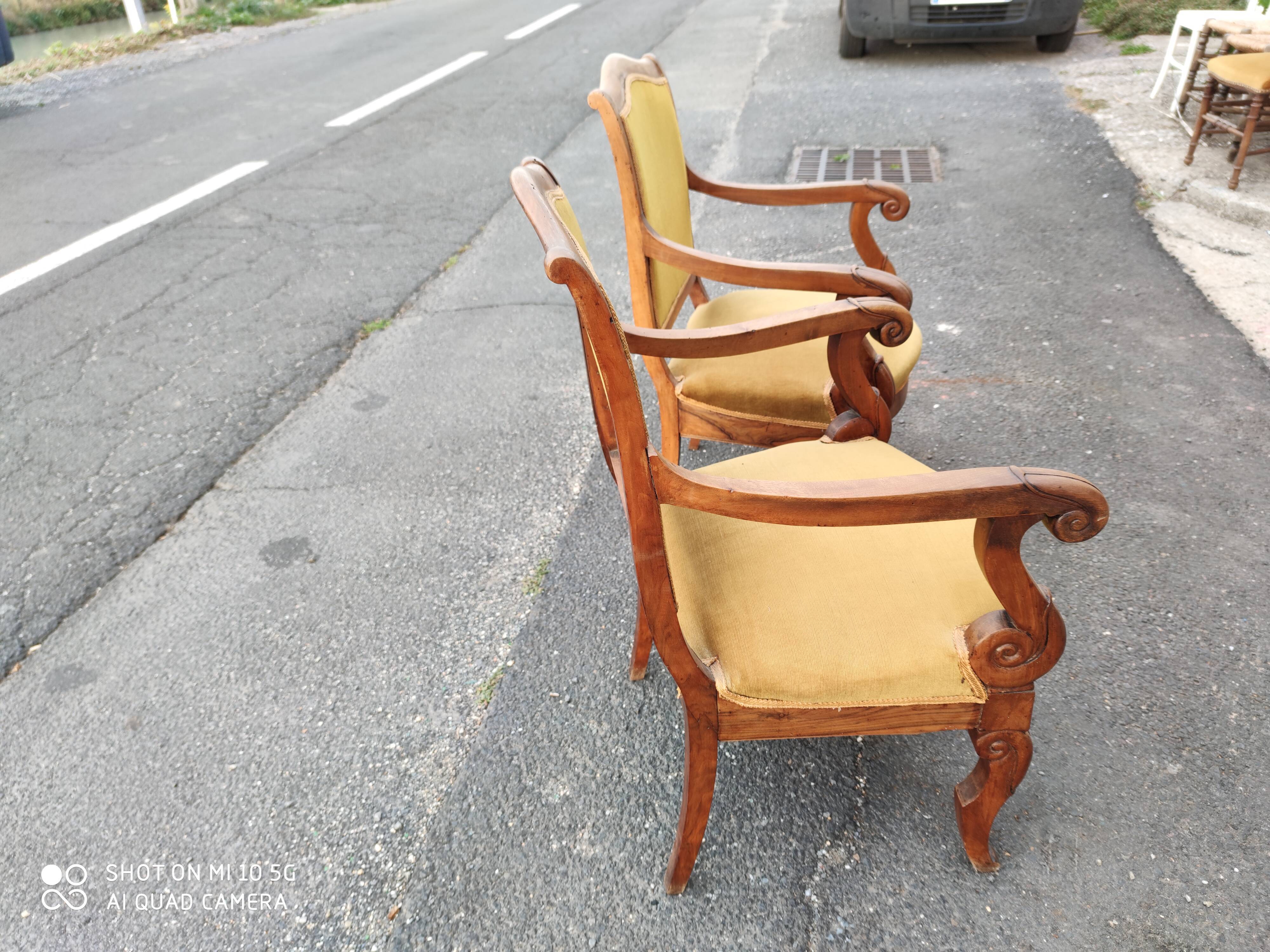 Pair of walnut armchairs from the Consulate period