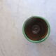 Cache enamelled terracotta pot