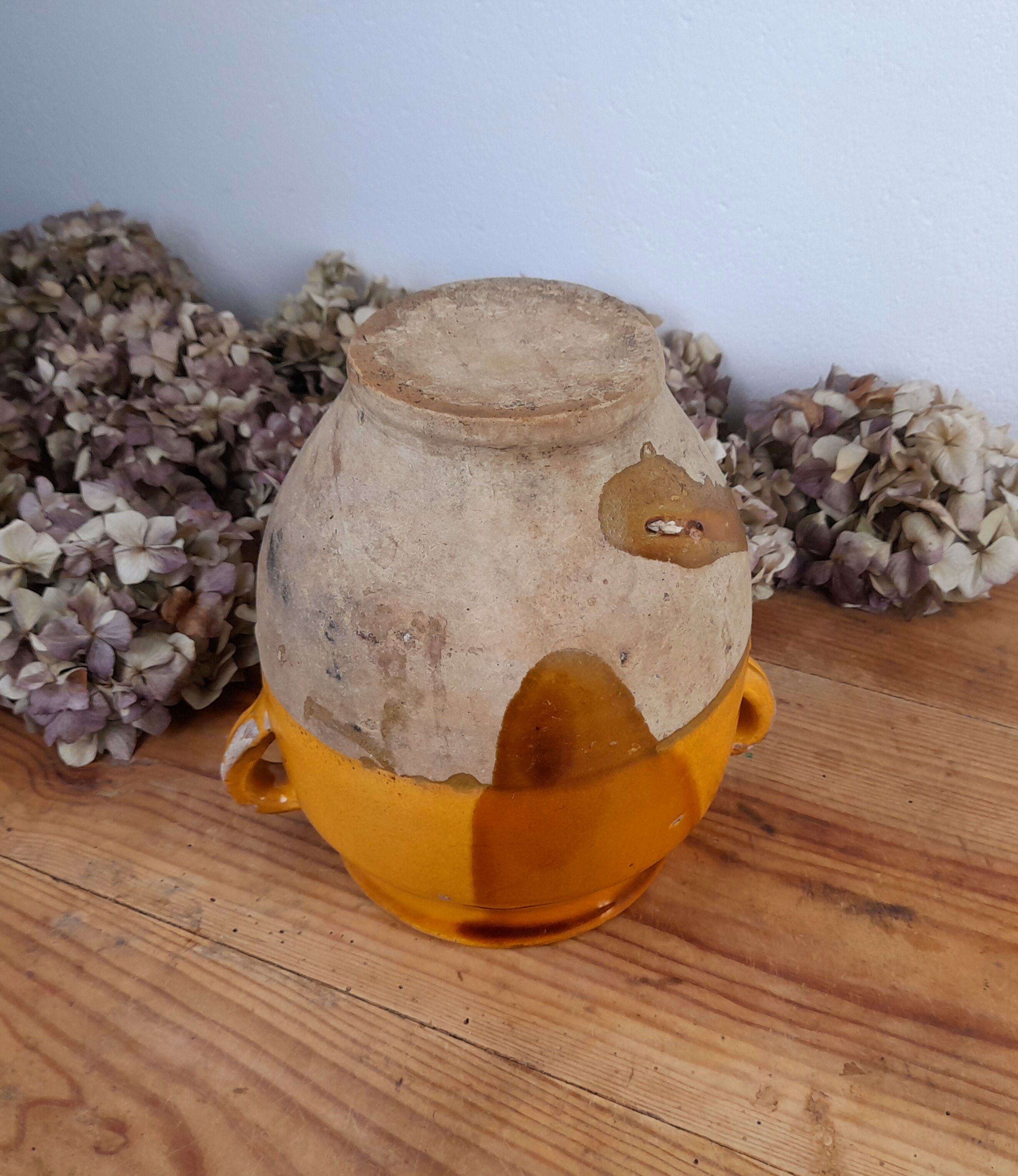 Old glazed terracotta grease pot