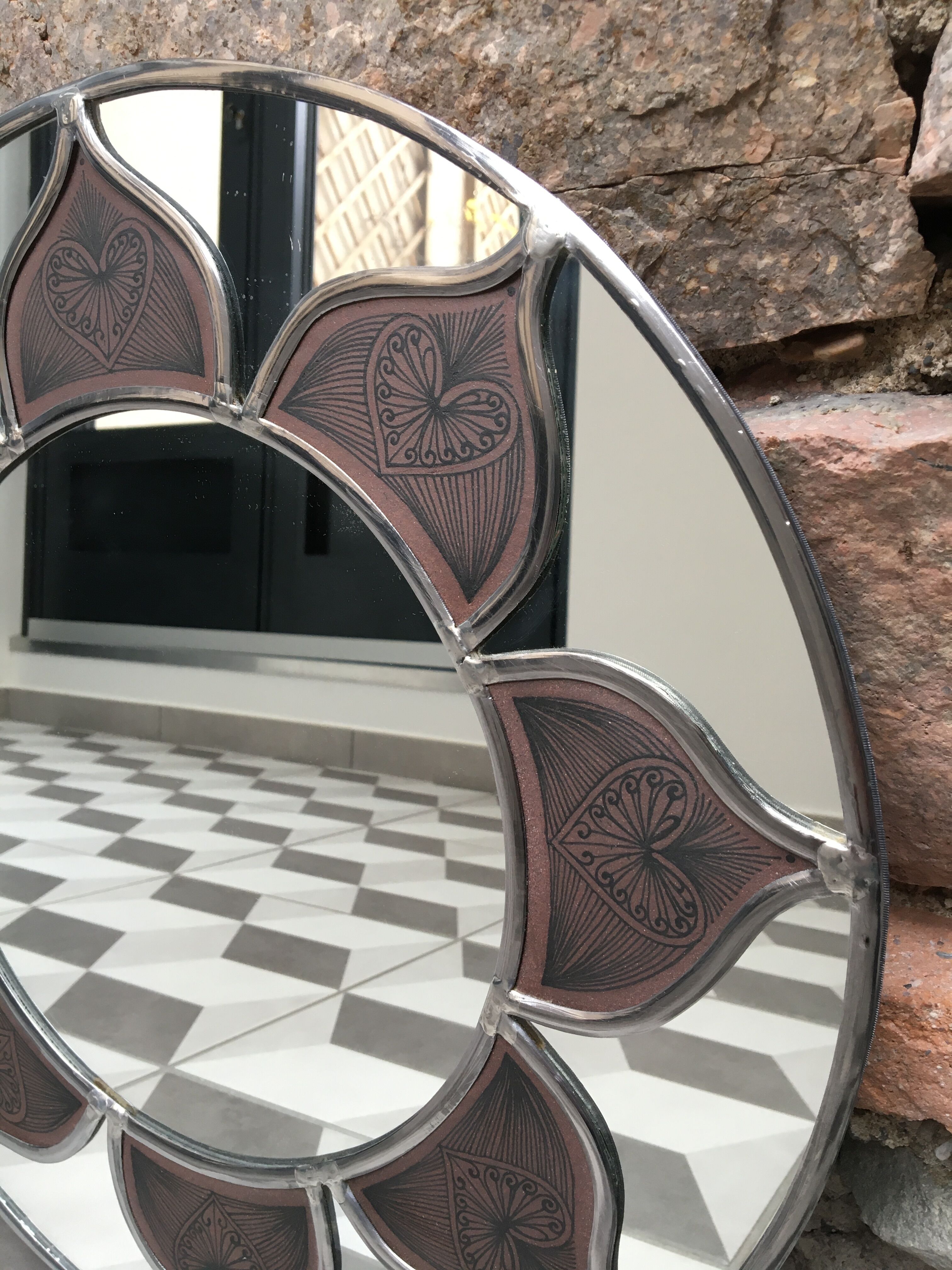 Mirror sun stained glass and ceramic inclusions