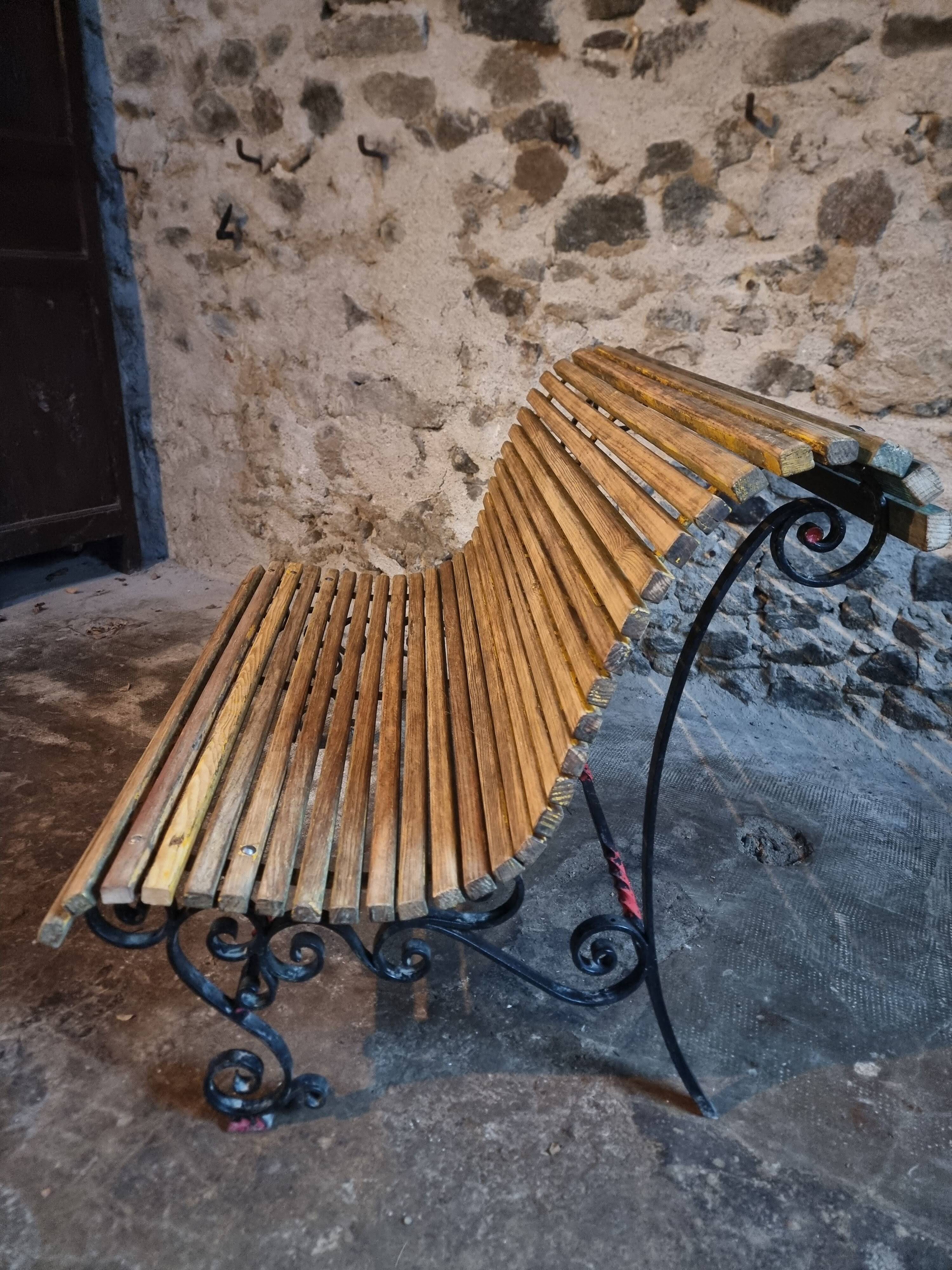 French garden bench in iron and wooden slats, mid-20th century.