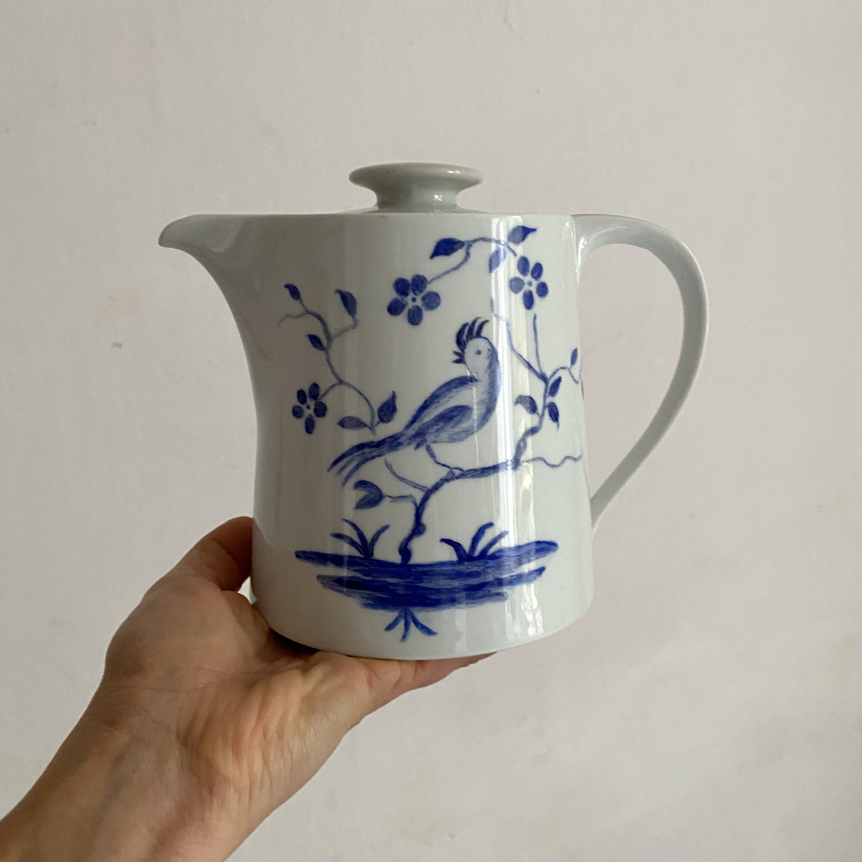 Porcelain teapot with hand-painted bird decoration