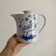 Porcelain teapot with hand-painted bird decoration