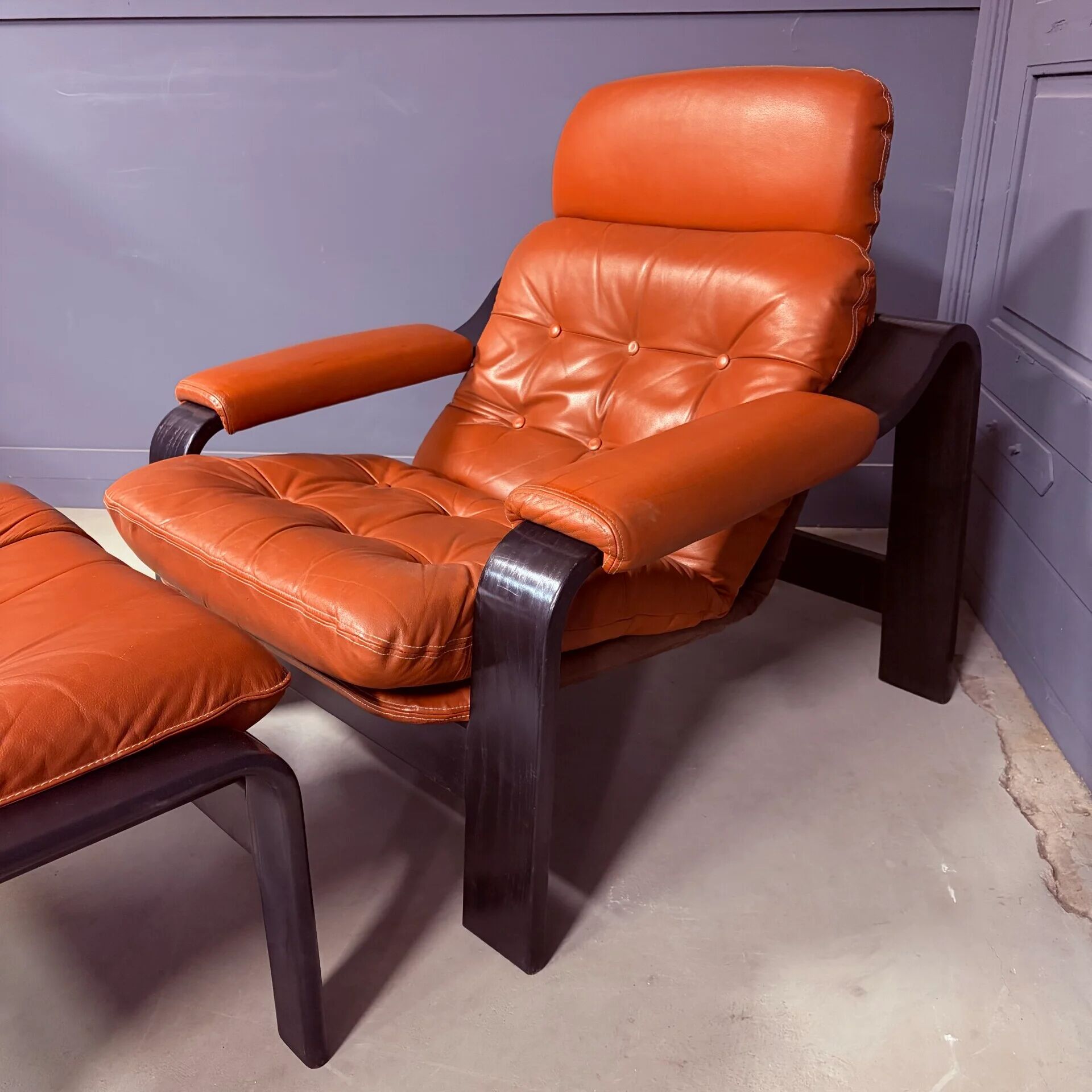 Vintage 1970s armchair with ottoman, leather and wood