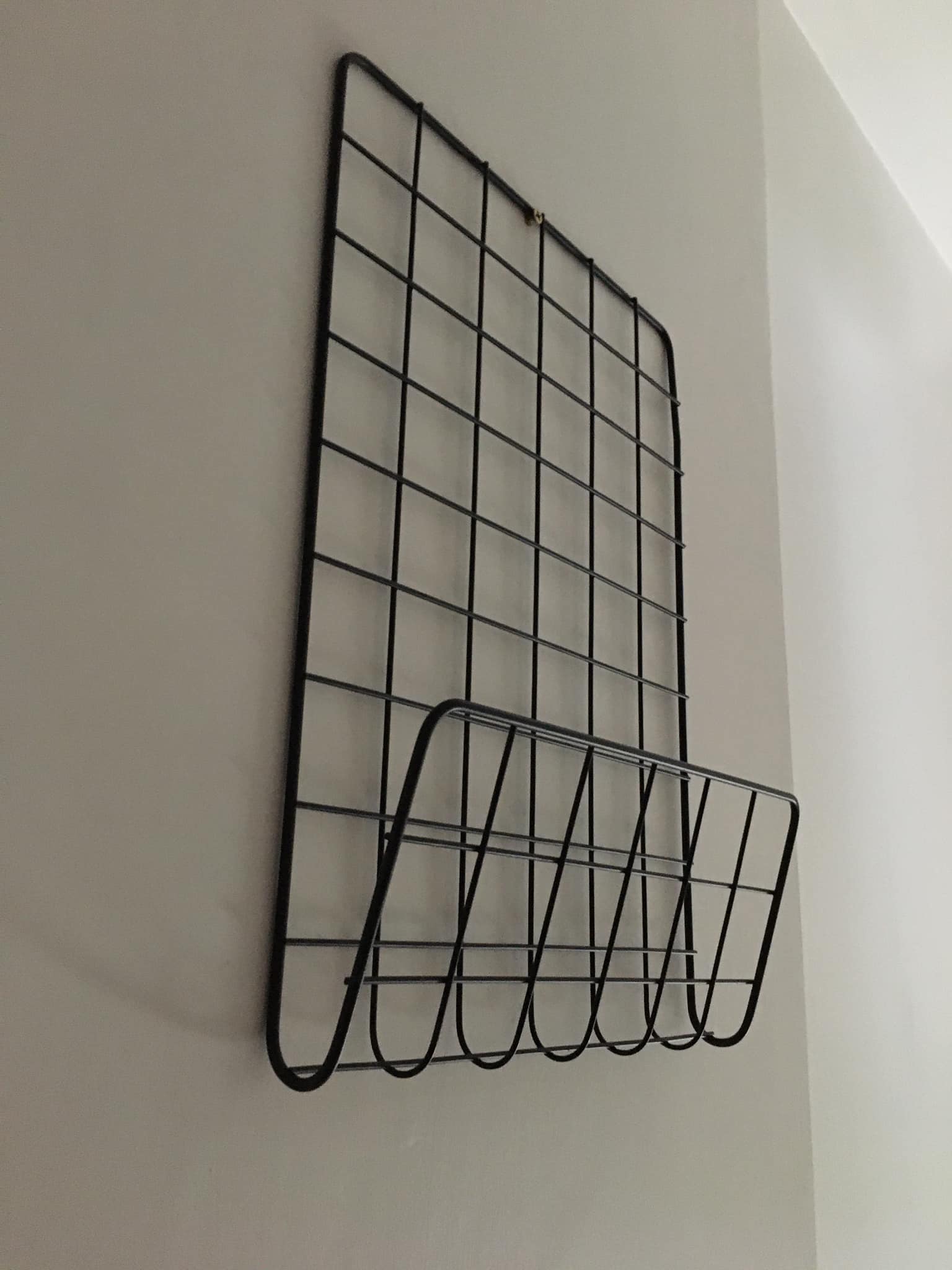Black metal wall magazine racks to hang