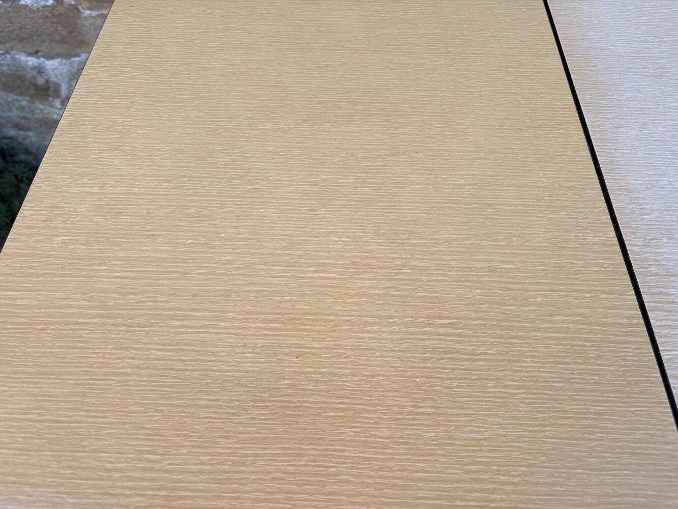 Beige French modernist extendable table, wooden legs, circa 1955.