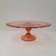 Pink pressed glass cake stand