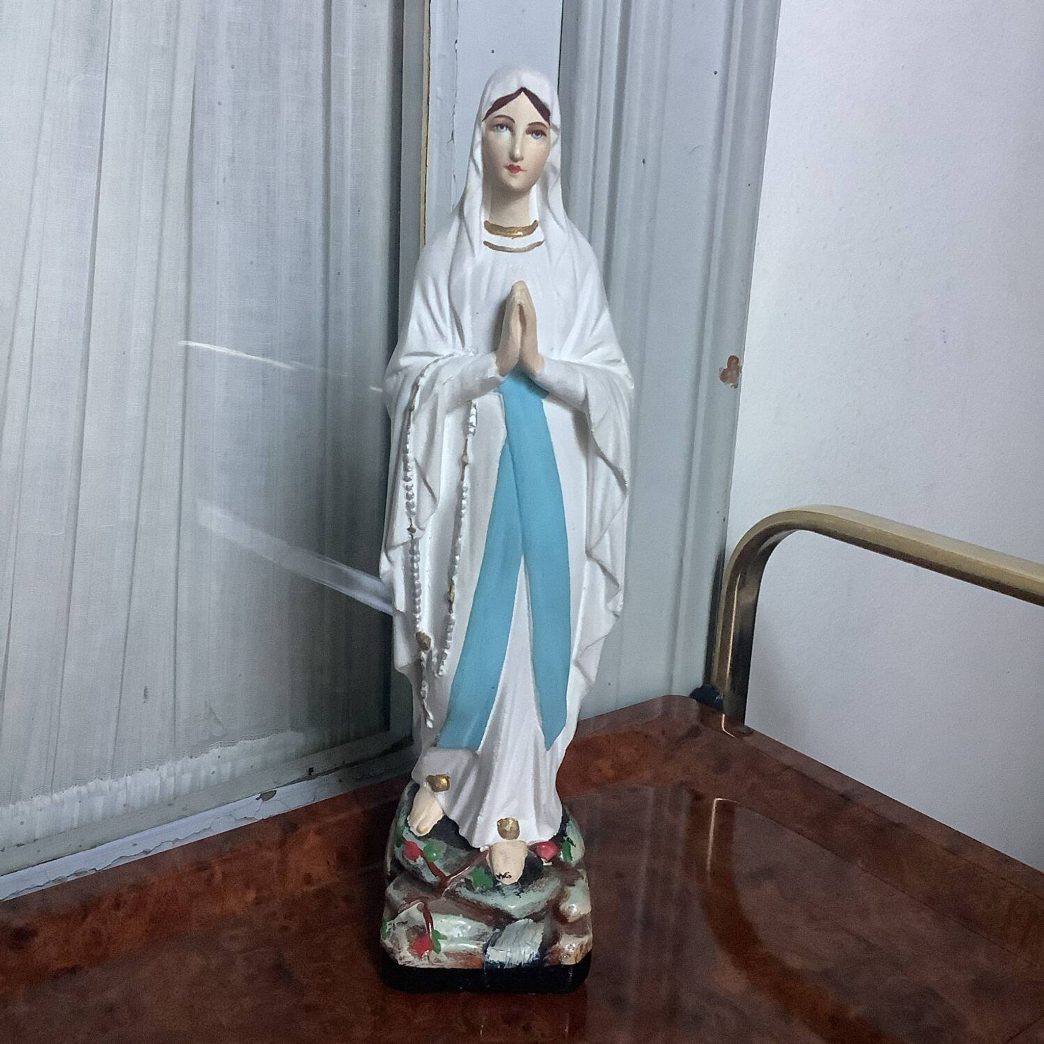 Small plaster statue of the Virgin Mary