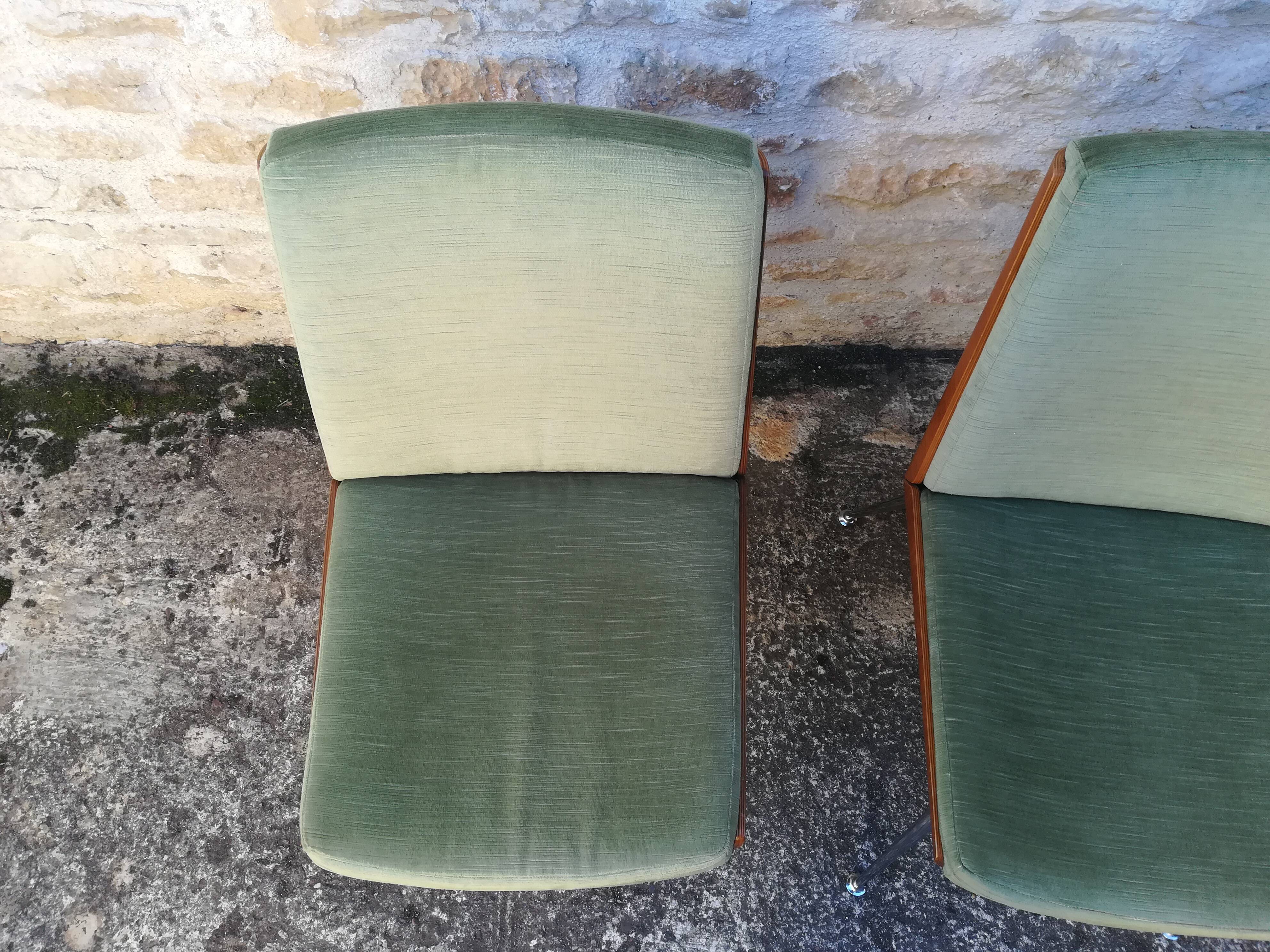 Shell chairs and green fabric