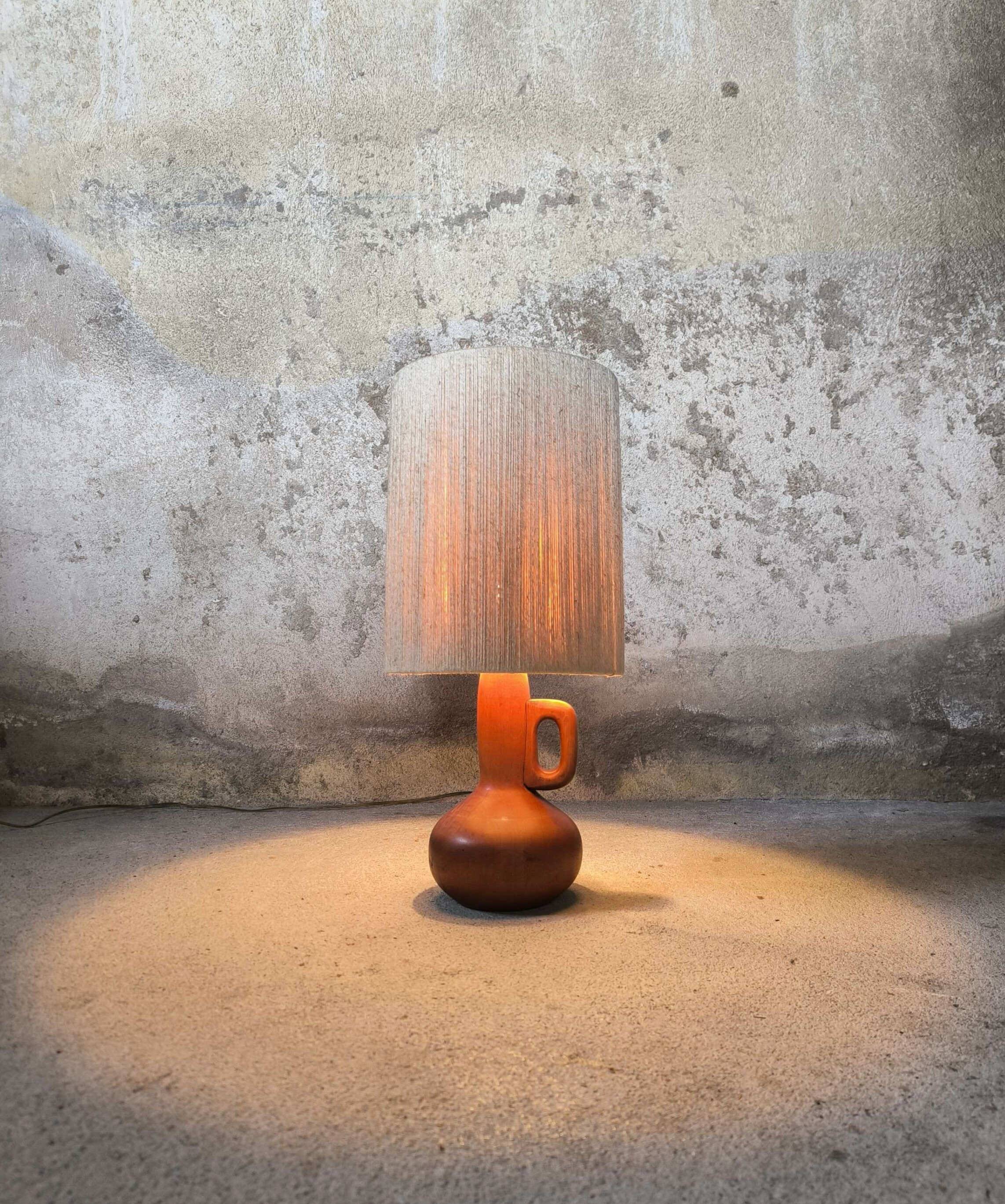 Vintage wooden table lamp with a wool shade.