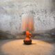 Vintage wooden table lamp with a wool shade.