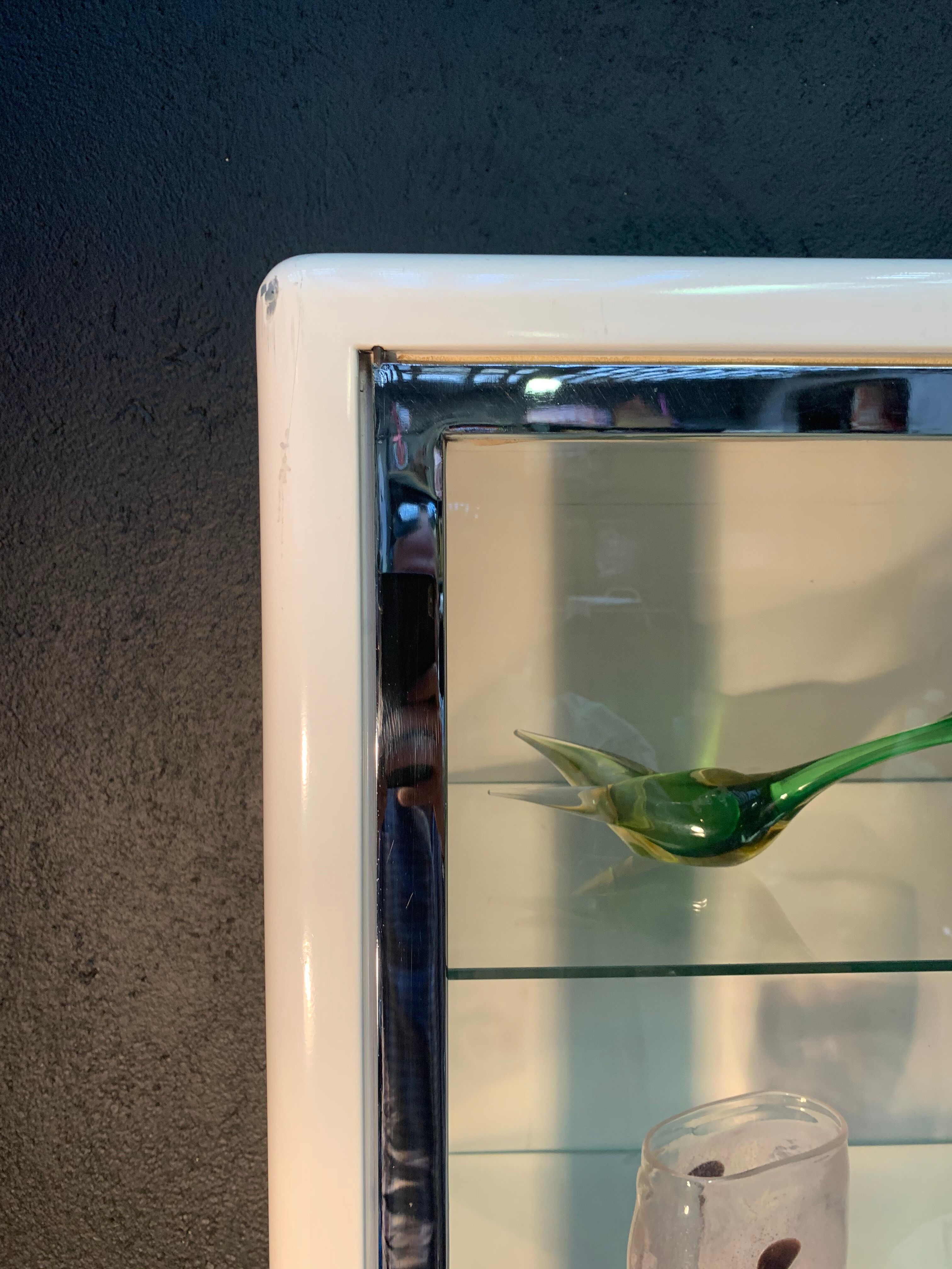 White enamelled metal design showcase. Period 1960