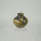 Sandstone ball vase by Eugène Lion