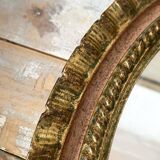 Oval Florentine mirror in powder pink and gold wood, 1960s.