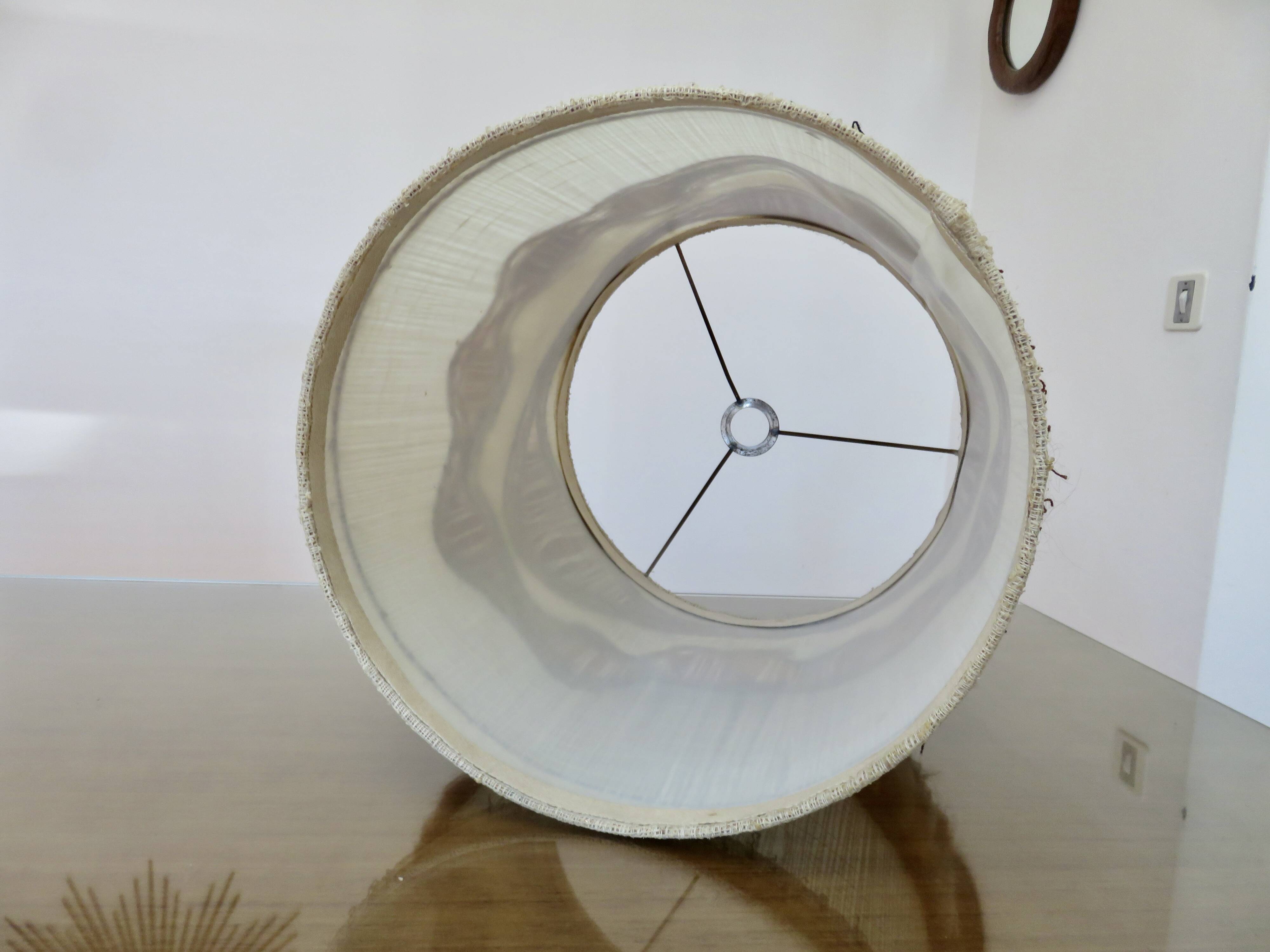 Ceramic lamp with double lighting and openwork design.