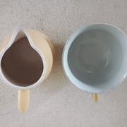 Earthenware cup and milk jar